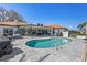 Resort style pool with elegant brick pavers surrounded by a beautiful outdoor living space, perfect for entertaining and relaxation at 4901 Lansing St Ne, St Petersburg, FL 33703