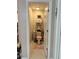 Neutral powder room featuring a small vanity, toilet, and decorative shelves with plants and soft pink accents at 4908 Wild Senna Blvd, Tampa, FL 33619