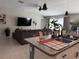 Modern kitchen with granite countertops, stainless steel sink, and open view to the living room at 4908 Wild Senna Blvd, Tampa, FL 33619