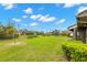 Lush backyard with mature trees and manicured landscaping offers great outdoor space at 50 Gretchen Ct, Oldsmar, FL 34677