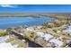 Expansive aerial view showcasing the riverfront property, including boatlifts, seawall, and nearby water access at 541 Ridgecrest Dr, Punta Gorda, FL 33982