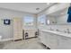 Bathroom featuring double sinks, natural light, and ample counter space at 541 Ridgecrest Dr, Punta Gorda, FL 33982
