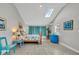 Bright bedroom featuring a skylight, beach-themed decor, and neutral color palette at 541 Ridgecrest Dr, Punta Gorda, FL 33982