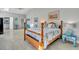 Bedroom suite with beach-themed decor, and light wood furniture at 541 Ridgecrest Dr, Punta Gorda, FL 33982