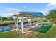 Covered boat lift and dock on a canal, providing convenient water access and boat storage at 541 Ridgecrest Dr, Punta Gorda, FL 33982