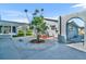 Charming courtyard with unique landscaping, stone pavers, and serene outdoor space at 541 Ridgecrest Dr, Punta Gorda, FL 33982