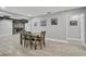 The dining room has an open view of the den with its electric fireplace feature at 541 Ridgecrest Dr, Punta Gorda, FL 33982