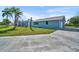 Charming one-story home with a well-manicured front lawn and attached garage, showcasing its inviting curb appeal at 541 Ridgecrest Dr, Punta Gorda, FL 33982