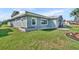 Well-maintained single story house with green lawn and landscaped flower bed at 541 Ridgecrest Dr, Punta Gorda, FL 33982