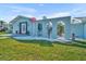 Charming home exterior with arched gate and well-manicured lawn displaying curb appeal at 541 Ridgecrest Dr, Punta Gorda, FL 33982