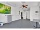 Spacious garage featuring a ceiling fan, ample lighting, and a functional layout perfect for a workshop or storage space at 541 Ridgecrest Dr, Punta Gorda, FL 33982