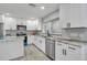 Contemporary kitchen features granite countertops, stainless appliances, and ample storage at 541 Ridgecrest Dr, Punta Gorda, FL 33982