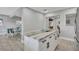This kitchen features a marble countertop island with cabinet space for storage and dining room view at 541 Ridgecrest Dr, Punta Gorda, FL 33982