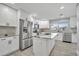 Modern kitchen with stainless steel appliances, white cabinets, and center island at 541 Ridgecrest Dr, Punta Gorda, FL 33982