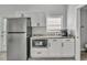 Efficient kitchenette features stainless-steel appliances and ample storage at 541 Ridgecrest Dr, Punta Gorda, FL 33982