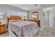 The main bedroom features tile floors, natural light, and traditional furnishings at 541 Ridgecrest Dr, Punta Gorda, FL 33982