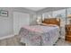 A traditionally decorated main bedroom features a large bed and closet at 541 Ridgecrest Dr, Punta Gorda, FL 33982