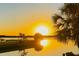 Beautiful sunset reflecting off the calm water showcasing the beauty of waterfront living at 541 Ridgecrest Dr, Punta Gorda, FL 33982