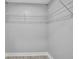 A walk-in closet with wire shelving on the upper walls, and neutral tile flooring at 541 Ridgecrest Dr, Punta Gorda, FL 33982