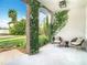 Inviting front porch featuring comfortable seating and lush greenery for a relaxing outdoor space at 607 N Sterling Ave, Tampa, FL 33609