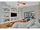 Cozy living room with built-in shelves, a comfortable sofa, and a sliding door leading to a screened patio at 6809 Exeter Park Pl, Apollo Beach, FL 33572