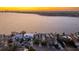 Panoramic aerial view of waterfront homes with bay views and the city skyline in the distance, an idyllic location at 72 Adalia Ave, Tampa, FL 33606