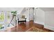 Cozy attic nook with hardwood floors, chair, and a large window offering natural light at 72 Adalia Ave, Tampa, FL 33606