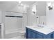 Stylish bathroom with a marble countertop vanity, classic fixtures, and subway tile at 72 Adalia Ave, Tampa, FL 33606