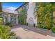 Beautiful courtyard with lush landscaping, a fountain, and architectural details at 72 Adalia Ave, Tampa, FL 33606