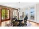 Dining room with brick archway and glass table with a view of the water at 72 Adalia Ave, Tampa, FL 33606