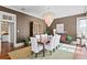 Sophisticated dining room with elegant lighting, dark-tone walls, and seating for eight at 72 Adalia Ave, Tampa, FL 33606