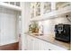 Kitchen featuring granite counters and a built-in coffee machine at 72 Adalia Ave, Tampa, FL 33606
