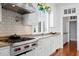 Kitchen featuring granite counters and a stainless steel range at 72 Adalia Ave, Tampa, FL 33606