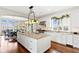 Bright kitchen with granite counters, large island, and stainless steel appliances at 72 Adalia Ave, Tampa, FL 33606