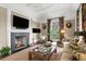 Inviting living room featuring fireplace, comfortable seating, and stylish decor at 72 Adalia Ave, Tampa, FL 33606