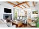 Cozy living room with fireplace, hardwood floors, and comfortable seating at 72 Adalia Ave, Tampa, FL 33606