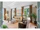 Cozy living room with designer furnishings, hardwood floors, and ample natural light at 72 Adalia Ave, Tampa, FL 33606