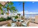 Relaxing outdoor seating with beautiful water views and lush landscaping at 72 Adalia Ave, Tampa, FL 33606