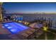 Beautiful waterfront pool and dock with lounge chairs, bay view, and lighted features for nighttime enjoyment at 72 Adalia Ave, Tampa, FL 33606