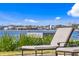 Exterior landscape featuring a waterfront view and lounge chairs in the background at 72 Adalia Ave, Tampa, FL 33606