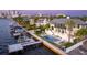 Luxury waterfront estate with a private pool, boat dock, and manicured gardens, providing the ultimate outdoor oasis at 72 Adalia Ave, Tampa, FL 33606