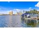 Tranquil waterfront view showing a boat dock and city skyline in the background at 72 Adalia Ave, Tampa, FL 33606