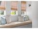 Cozy window seat with cushions and natural light streaming through the blinds at 72 Adalia Ave, Tampa, FL 33606
