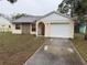 Charming single Gathering home featuring a one car garage and stone facade at 7425 Riverbank Dr, New Port Richey, FL 34655