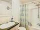 Standard bathroom featuring a tub with shower and a single sink at 8523 Hamster Dr, Zephyrhills, FL 33540