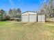 Metal garage building with parking and storage at 8523 Hamster Dr, Zephyrhills, FL 33540