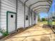 Garage with covered parking and a door to a workspace at 8523 Hamster Dr, Zephyrhills, FL 33540