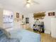 View of the main bedroom showcasing a chair, dresser, and attached bathroom at 8523 Hamster Dr, Zephyrhills, FL 33540