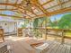 Outdoor patio with a hot tub, exercise equipment, and shade from the sun at 8523 Hamster Dr, Zephyrhills, FL 33540
