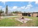 Spacious backyard featuring a pool, a fire pit, and a screened in patio at 8724 N Renfrew Pl, Tampa, FL 33604